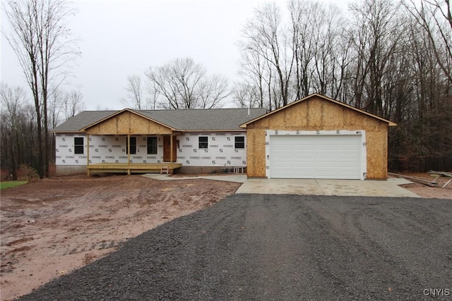 view of front facade with a garage and a porch