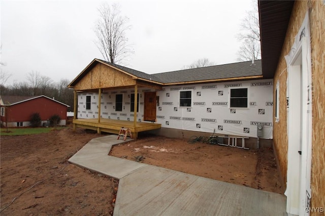 property in mid-construction featuring covered porch