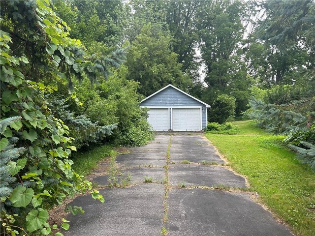 garage featuring a lawn