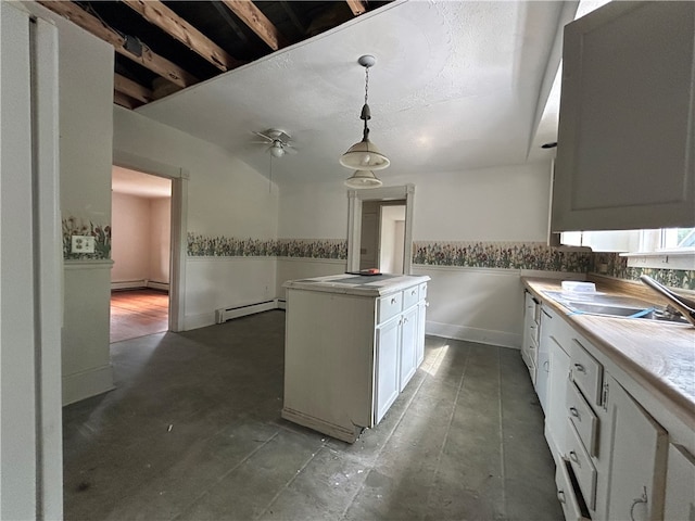 kitchen featuring a baseboard radiator, tile patterned floors, ceiling fan, and decorative light fixtures