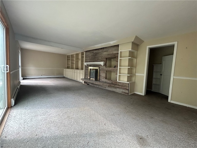 unfurnished living room featuring dark carpet, a fireplace, and a baseboard heating unit