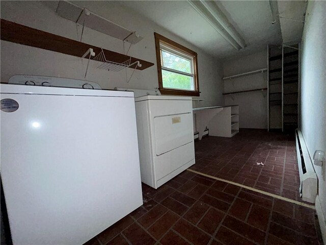 laundry room featuring independent washer and dryer and a baseboard radiator