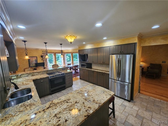 1666 Buffs Blf, Skaneateles, NY 13152 - kitchen featuring appliances with stainless steel finishes, a peninsula, crown molding, decorative backsplash, and hanging light fixtures