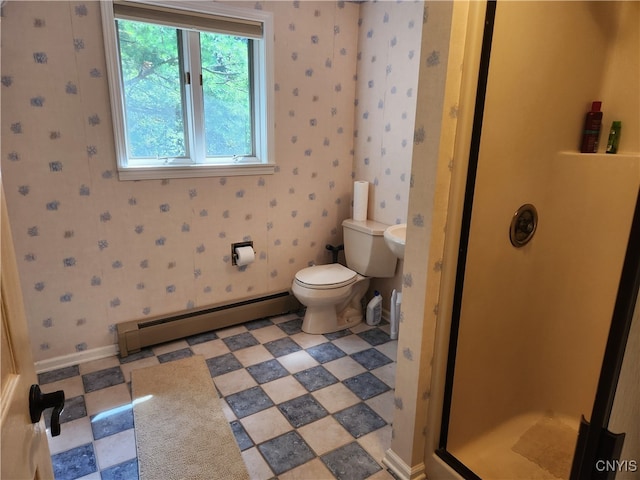 bathroom featuring toilet, a shower, and a baseboard radiator