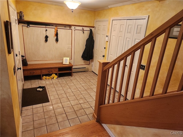 mudroom featuring light tile patterned flooring, ornamental molding, and a baseboard heating unit