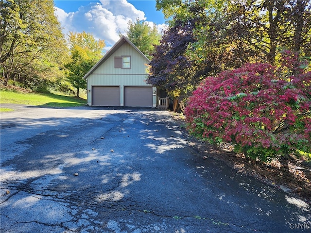 view of side of home featuring a garage