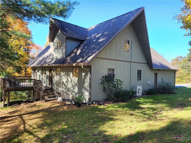 1666 Buffs Blf, Skaneateles, NY 13152 - view of home's exterior with a wooden deck, a yard, a shingled roof, and stairs