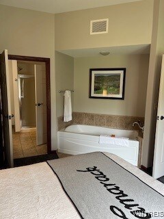 bathroom featuring a tub and tile patterned floors