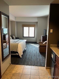 bedroom with light tile patterned flooring