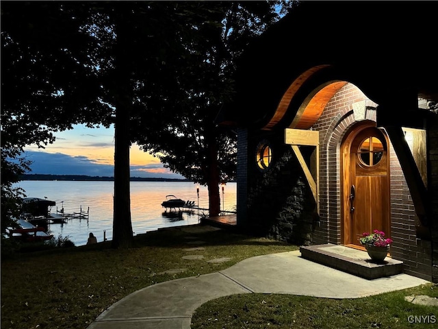 patio terrace at dusk with a water view