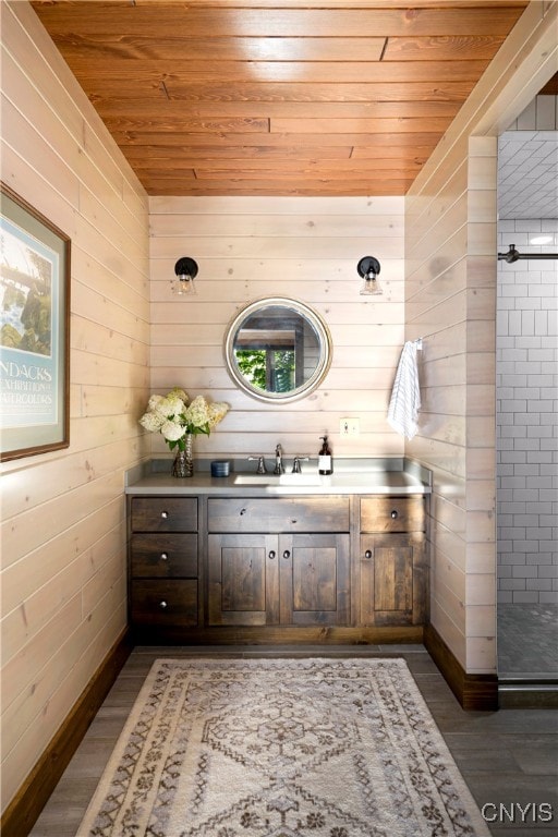 bathroom featuring vanity, wooden ceiling, and hardwood / wood-style flooring