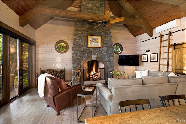 living room featuring wooden walls, a barn door, wood ceiling, and wood-type flooring