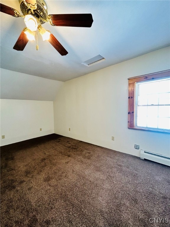 additional living space with a baseboard heating unit, ceiling fan, lofted ceiling, and carpet