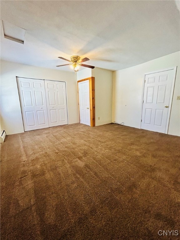 unfurnished bedroom with ceiling fan, carpet flooring, and baseboard heating