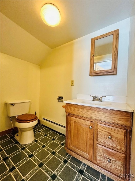 bathroom featuring vanity, a baseboard radiator, tile patterned flooring, and toilet