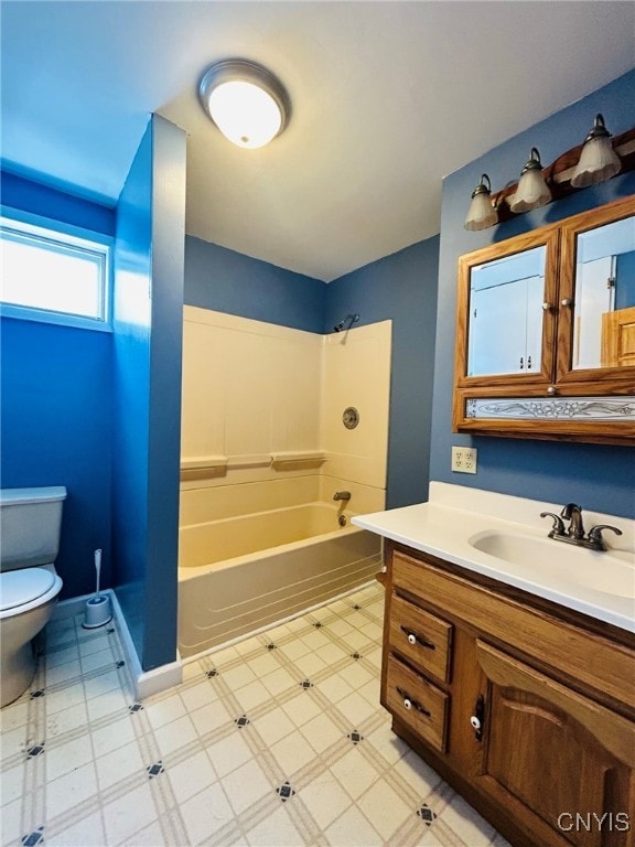 full bathroom featuring washtub / shower combination, toilet, tile patterned floors, and vanity