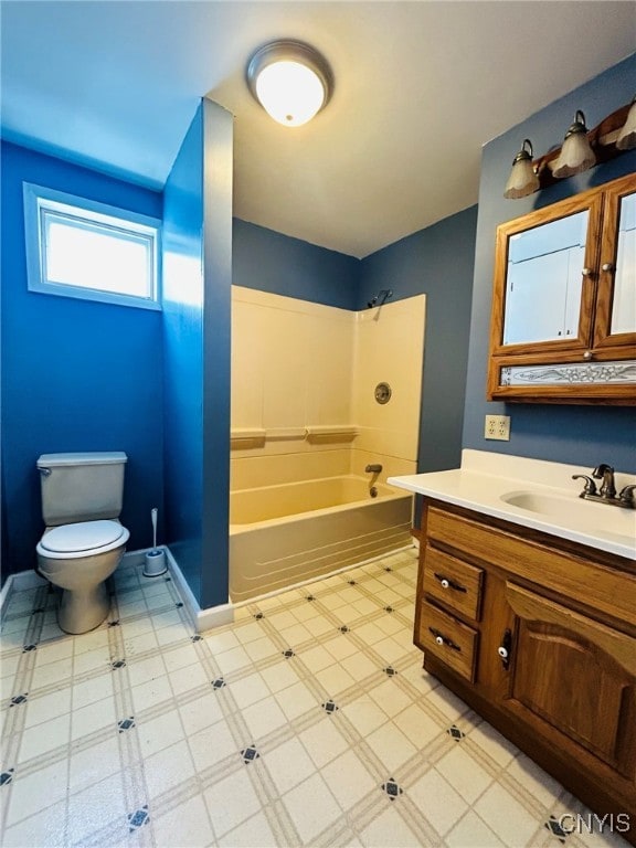 bathroom with toilet, tile patterned floors, and vanity