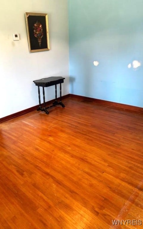 unfurnished room featuring hardwood / wood-style floors