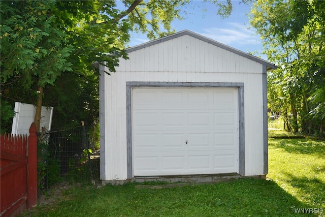 garage featuring a yard