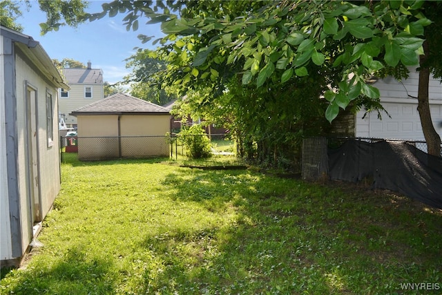 view of yard featuring a garage