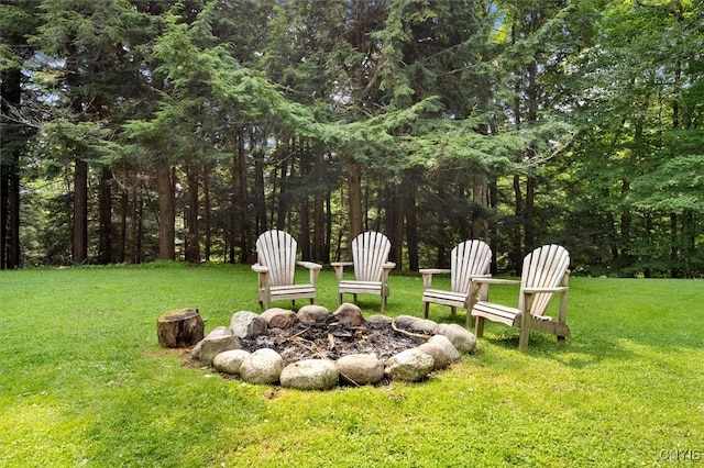 view of yard with a fire pit