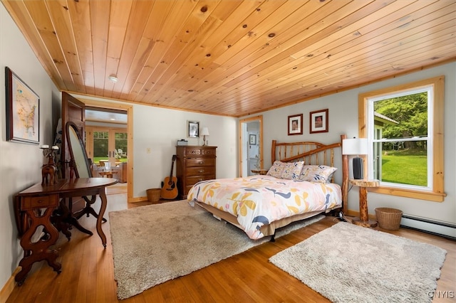 bedroom with wood ceiling, a baseboard radiator, and hardwood / wood-style flooring