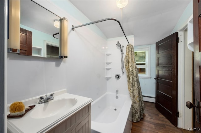 bathroom featuring a baseboard heating unit, vanity, shower / bath combo, and hardwood / wood-style floors