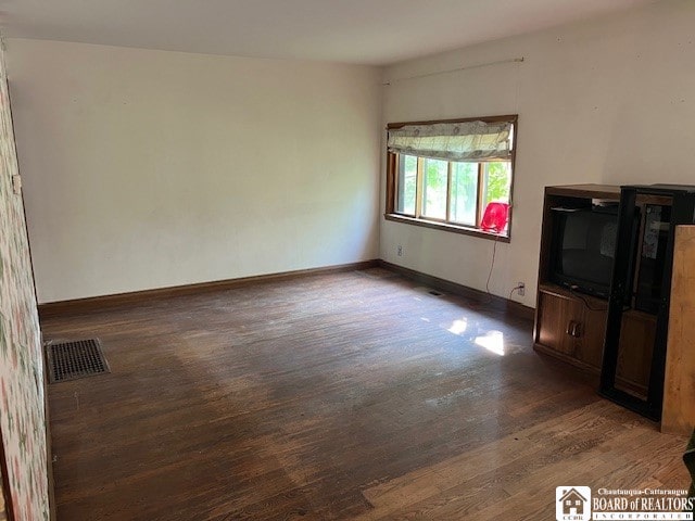 unfurnished living room with hardwood / wood-style flooring