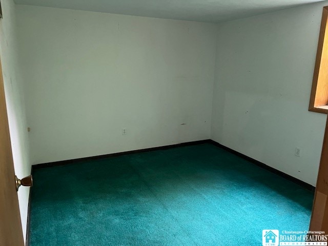 empty room with carpet flooring