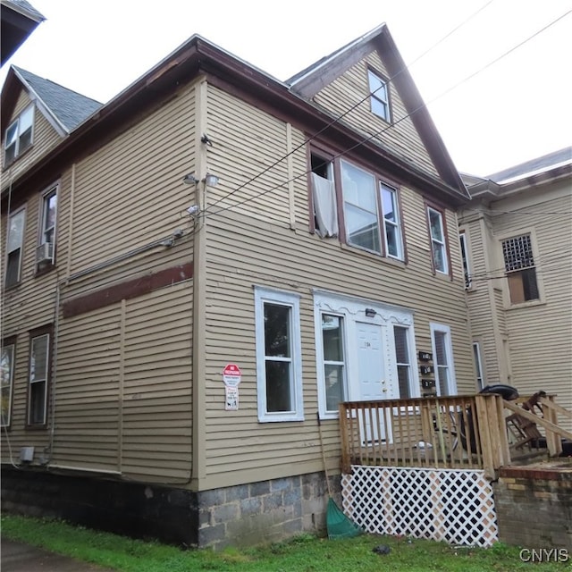 view of front of home with a wooden deck