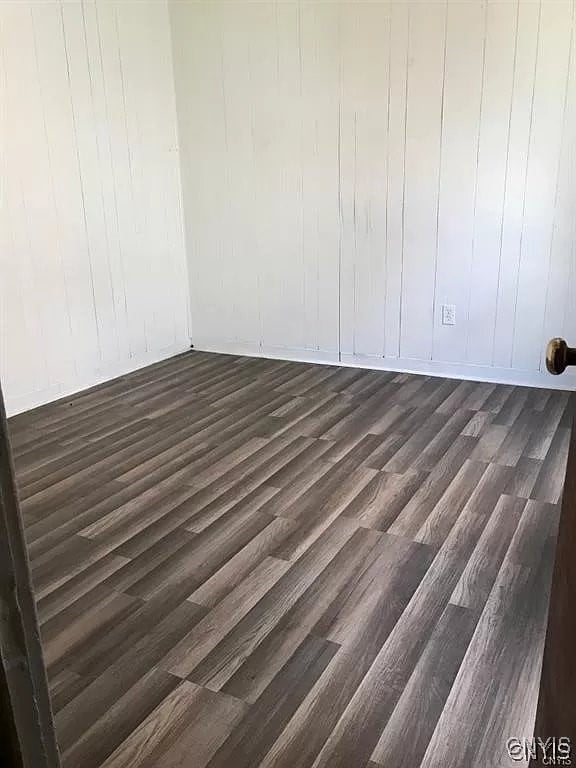 spare room with hardwood / wood-style floors