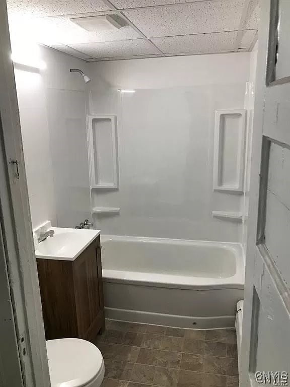 full bathroom featuring tub / shower combination, toilet, tile patterned floors, and vanity