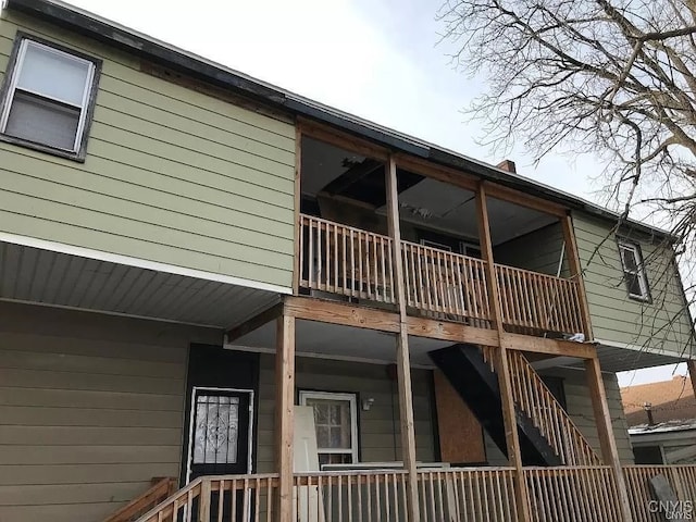 view of side of property with a balcony