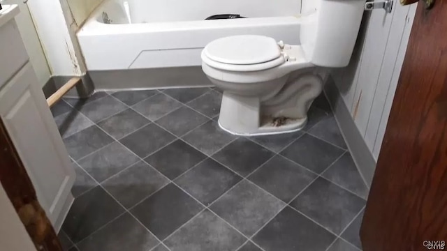 bathroom featuring tile patterned floors and toilet