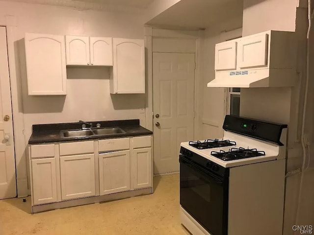 kitchen featuring range hood, sink, gas range gas stove, and white cabinetry