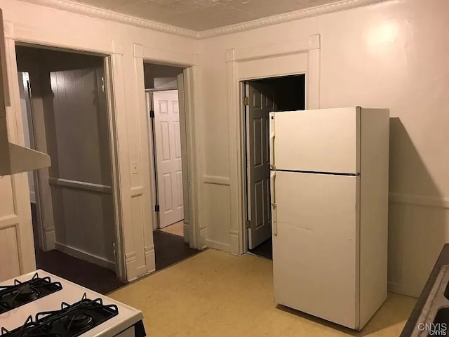 kitchen with range and white fridge