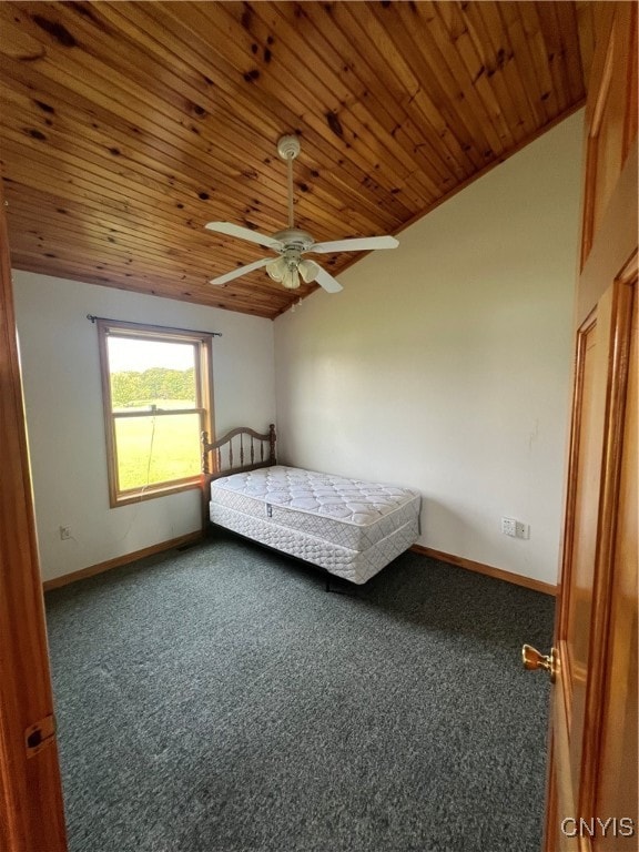 unfurnished bedroom with wood ceiling, carpet floors, ceiling fan, and lofted ceiling