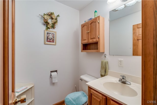 bathroom with vanity and toilet