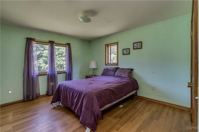 bedroom with light hardwood / wood-style flooring