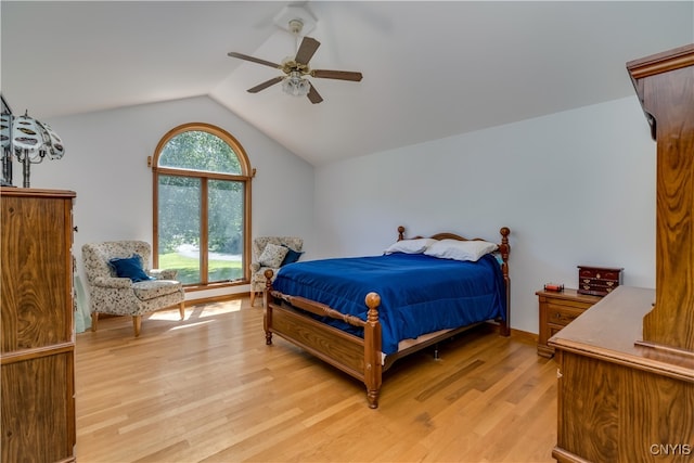 bedroom with ceiling fan, light hardwood / wood-style flooring, and multiple windows