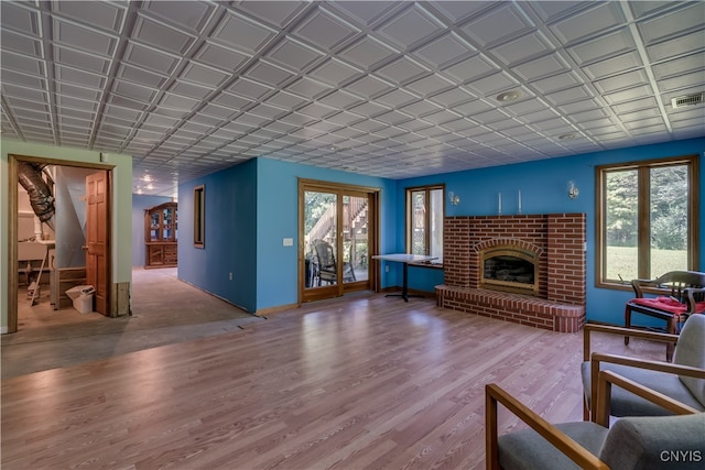 living room with a fireplace and hardwood / wood-style flooring