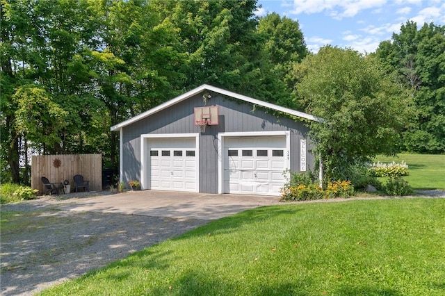 garage featuring a lawn