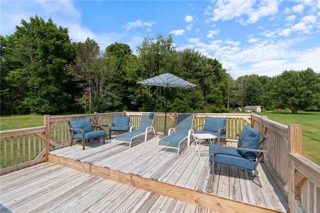 wooden deck with a lawn