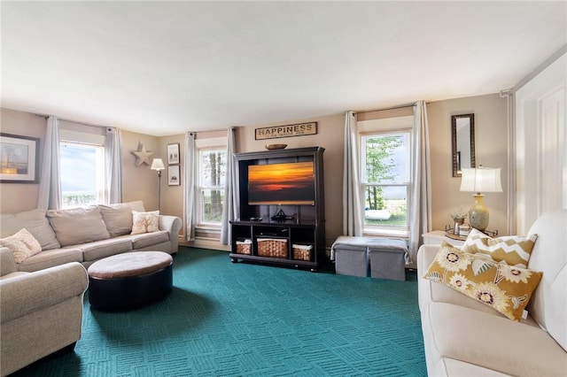 living room with carpet and a healthy amount of sunlight