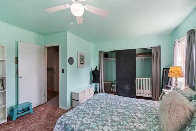 bedroom with carpet, ceiling fan, and a closet