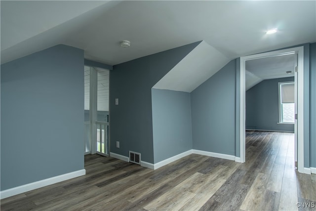 bonus room featuring lofted ceiling and wood-type flooring