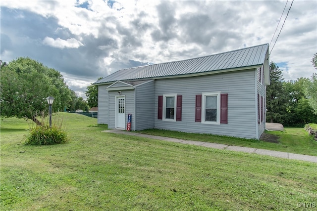 back of house with a yard