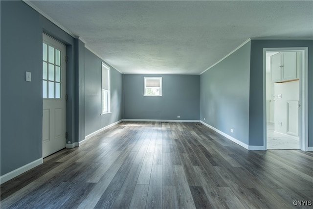 additional living space with hardwood / wood-style flooring and a textured ceiling