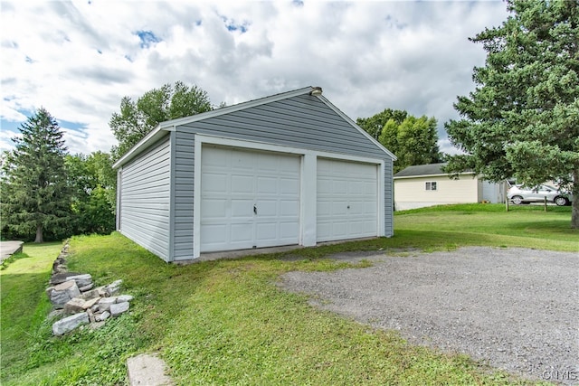 garage with a lawn