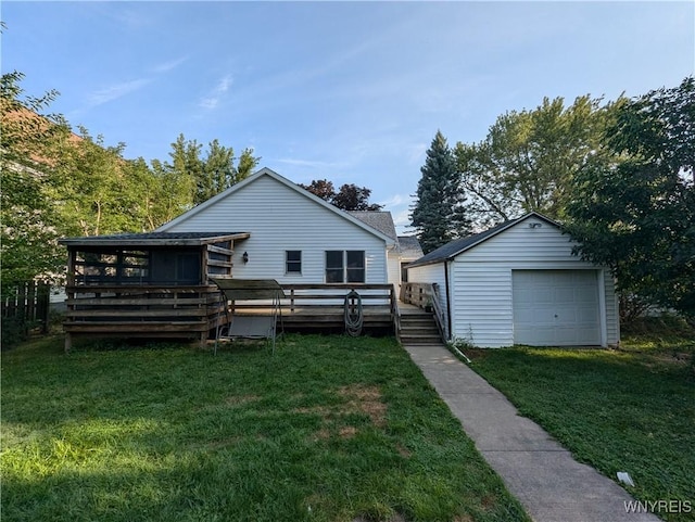 rear view of house with a deck, an outdoor structure, a garage, and a lawn